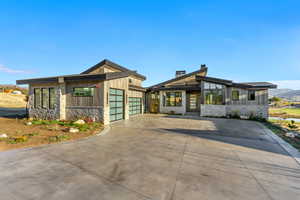 Contemporary house featuring a mountain view and a garage