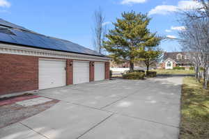 3 Car attached Garage with solar panels