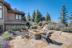 View of patio featuring an outdoor fire pit