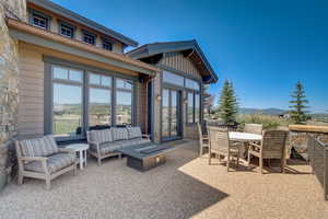 View of patio featuring a mountain view and a fire pit