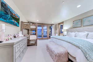 Bedroom featuring light colored carpet