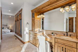 Bathroom with tile patterned floors and vanity