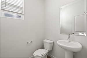 Bathroom featuring sink and toilet