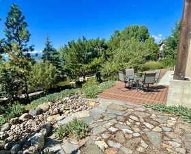 View of ground level deck and flagstone patio