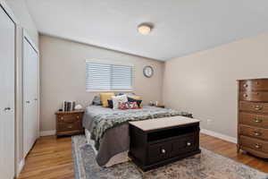 Bedroom with a closet and light wood-type flooring