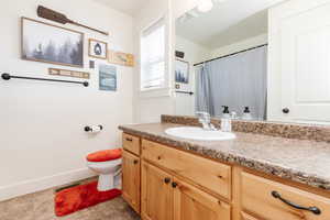 Bathroom with vanity and toilet