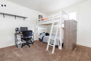 Bedroom featuring carpet floors