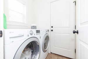 Laundry area featuring washer and clothes dryer