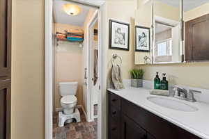 Bathroom with vanity and toilet