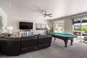 Playroom with ceiling fan, carpet, and billiards