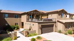 Mediterranean / spanish-style home with a balcony and a garage