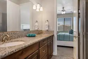 Bathroom with ceiling fan and vanity