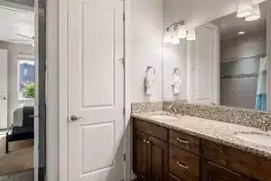 Bathroom featuring vanity and ceiling fan