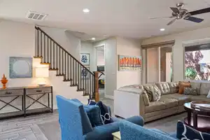 Living room featuring ceiling fan