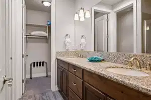 Bathroom with vanity and wood-type flooring