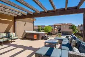 View of patio / terrace with outdoor lounge area, a pergola, and a hot tub