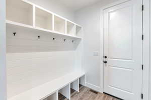 Mudroom with light hardwood / wood-style flooring