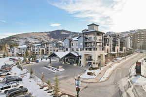 Snow covered property featuring a mountain view