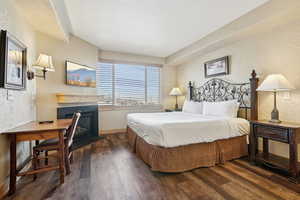 Bedroom featuring dark wood-type flooring