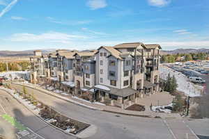 Birds eye view of property with a mountain view