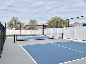 View of tennis court with basketball court