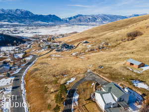 Snowy aerial view with a mountain view