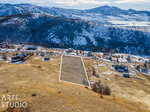 Snowy aerial view featuring a mountain view