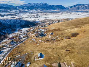 Snowy aerial view with a mountain view