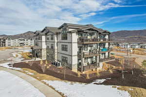 Exterior space with a mountain view and a balcony