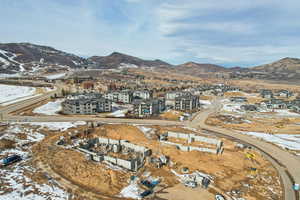 Snowy aerial view featuring a mountain view