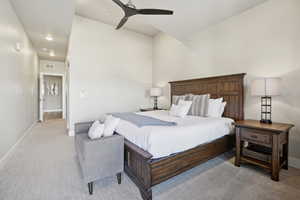 Bedroom with ceiling fan and light colored carpet