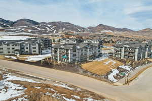 Snowy aerial view featuring a mountain view