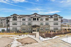 Snow covered building with a mountain view