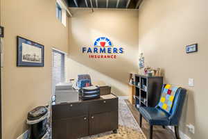 Office area with light wood-type flooring