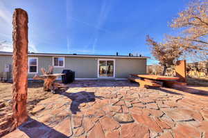 Rear view of house featuring a patio