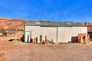 View of outbuilding with a mountain view