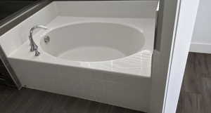 Bathroom featuring a relaxing tiled tub