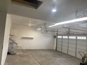 Garage featuring a garage door opener