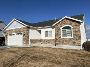 Single story home featuring a front yard