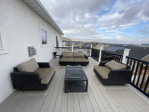 Wooden deck featuring an outdoor living space