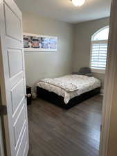 Bedroom featuring dark wood-type flooring