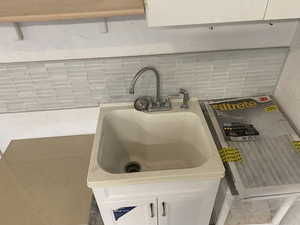 Interior details featuring decorative backsplash and sink