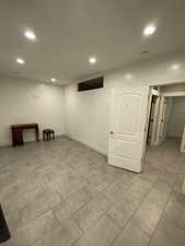 Basement with light tile patterned floors