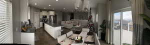 Living room featuring dark hardwood / wood-style flooring and a notable chandelier