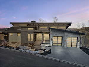 View of front of property featuring a garage