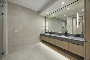 Bathroom featuring vanity and walk in shower