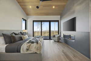 Bedroom with access to exterior, wooden ceiling, and multiple windows