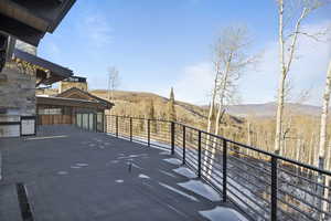 Balcony featuring a mountain view and grilling area