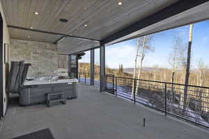 View of patio featuring a hot tub