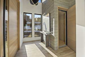 Interior space with wood walls and light wood-type flooring